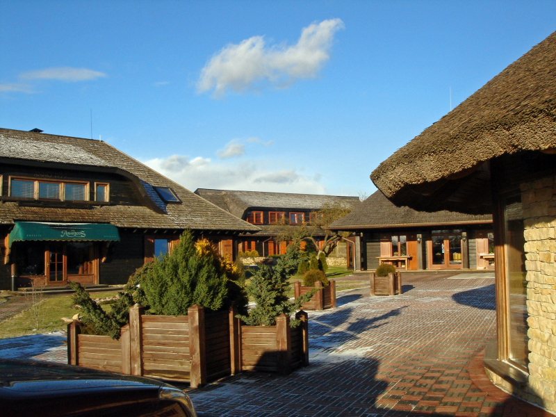 Aparjods hotel's thatched-roof buildings near Sigulda