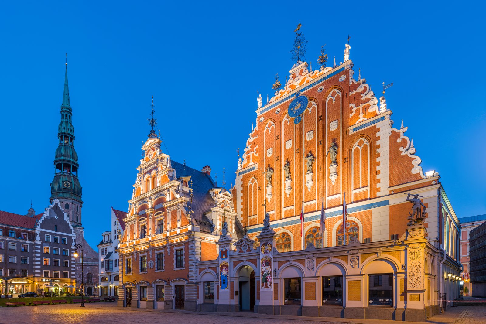 The House of the Blackheads and St. Peter's Church tower, Town Hall Square, Riga, at dusk